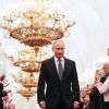 Россия верит настоящему Путину, а не коллективной верхушке (На фото: Избранный президент России Владимир Путин (в центре) на церемонии инаугурации в Андреевском…) На фото: Избранный п…